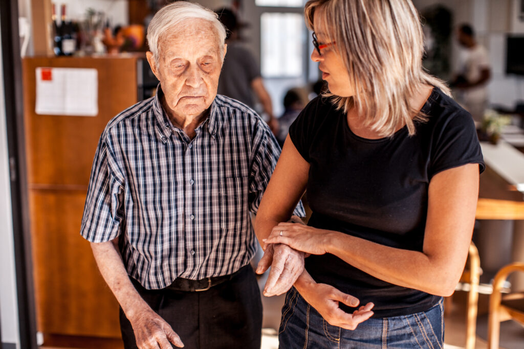 Senior Man with a Caregiver in an Elderly Daycare Center