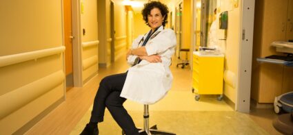 Dr. Jessica Zitter poses in a hospital hallway