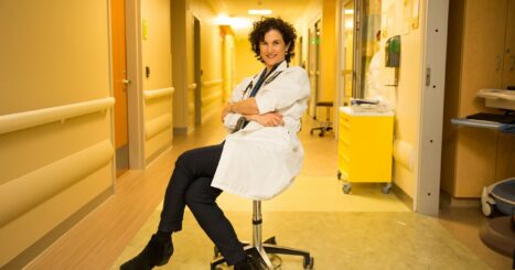 Dr. Jessica Zitter poses in a hospital hallway