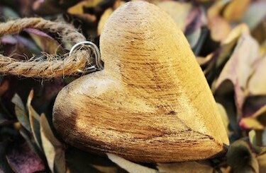 Wooden heart carving attached to a cord