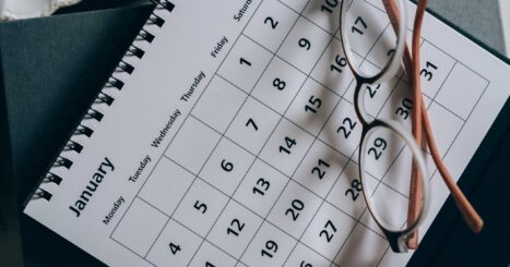 Paper calendar with reading glasses