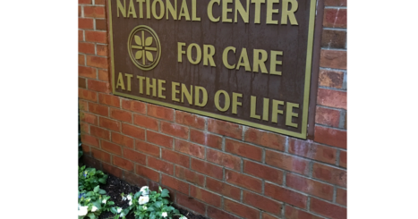 "National Center for Care at the End of Life" bronze plaque on brick building