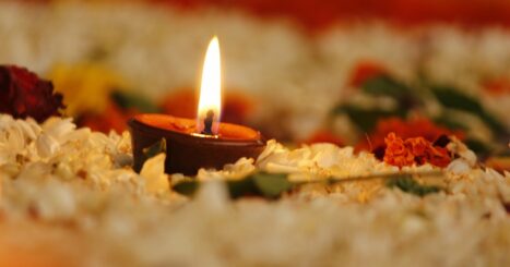 candles in memorial of flower petals