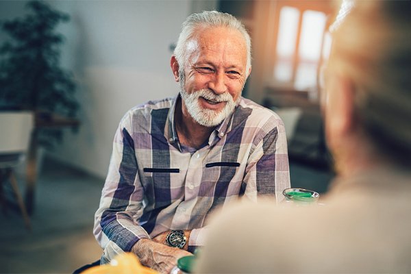 smiling older man in conversation