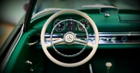 Steering wheel of classic emerald green Mercedes Benz